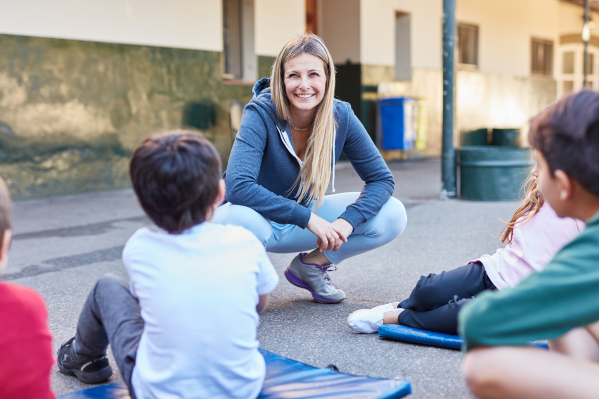 Teacher talking to students outside